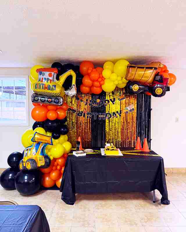 Construction-themed organic balloon garland